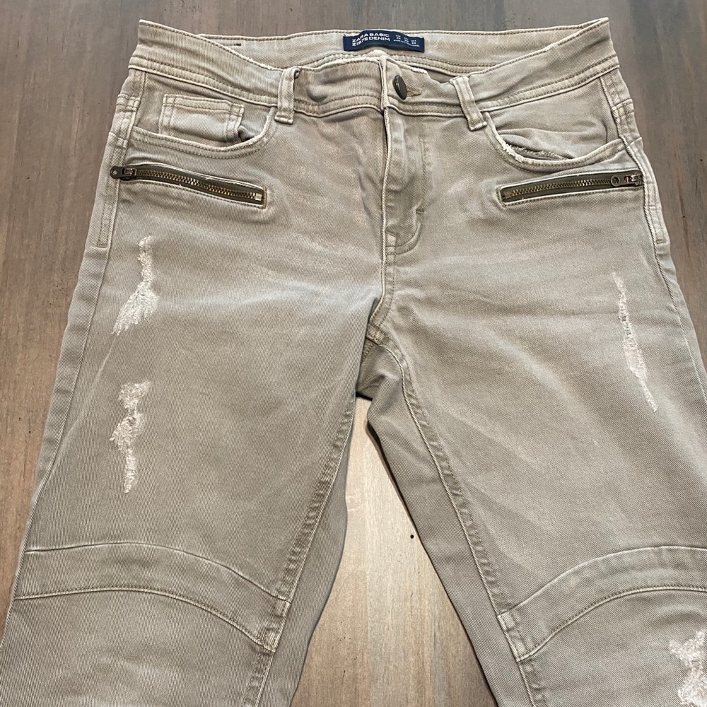 ripped light washed green high rise skinny jeans